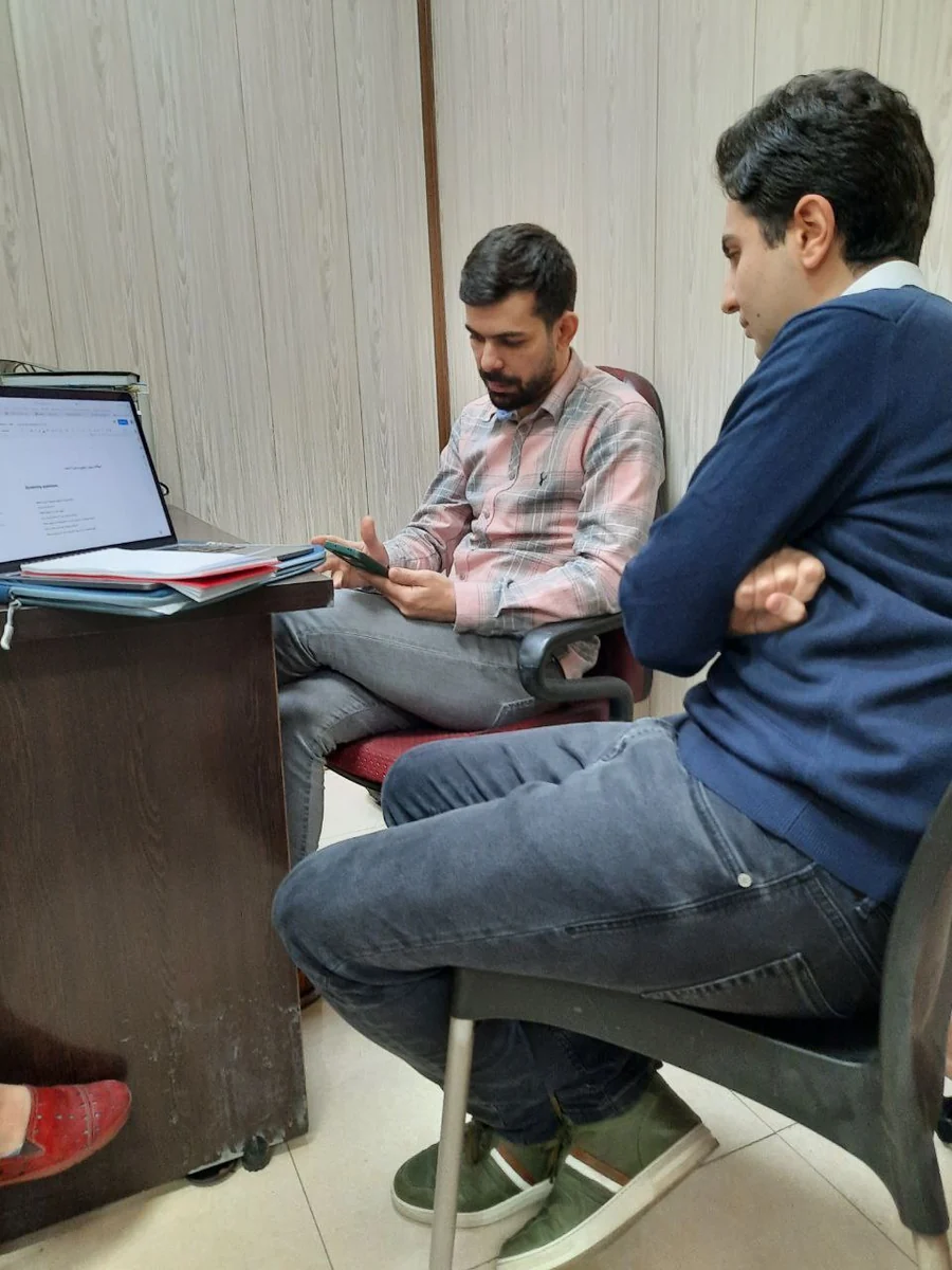 A seller working through tasks on his own phone while I take notes